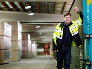 A man smiling in a storage