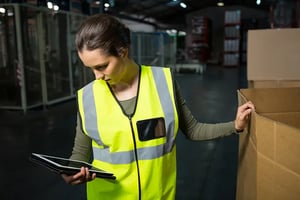 female-worker-using-tablet-pc-warehouse