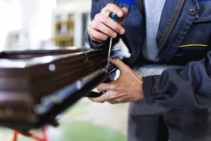 factory-worker-finishing-wooden-window