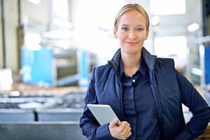 lady-holding-tablet-industrial-environment