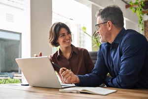 two-people-smiling-and-talking